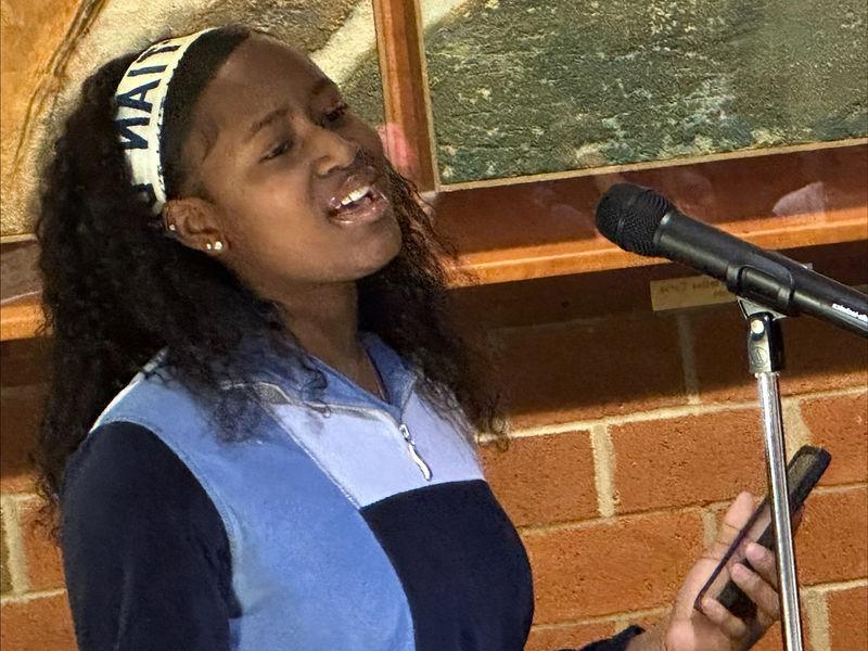 Student Makaylah Bangura performs a song a cappella.